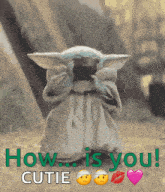 a baby yoda says how is you cutie with a heart and a kiss