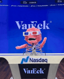 a pink skeleton wearing 3d glasses stands in front of a podium that says nasdaq vaneck