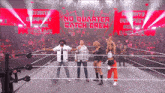 a group of people standing in a wrestling ring with the words no quarter catch crew on the screen behind them