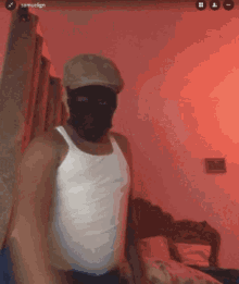 a man wearing a white tank top and a hat has the name samuel on the bottom left