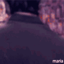 a man and a woman are looking at each other and the woman is covering her face