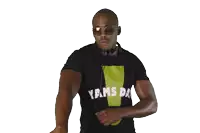 a man wearing sunglasses and a yams t-shirt