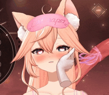 a girl with cat ears wears a sleep mask that says cat naps