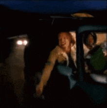 a blurry picture of a man in a car