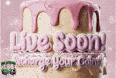 a cake with pink frosting and the words live soon recharge your coins