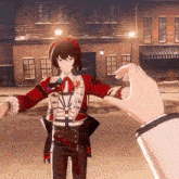 a person 's hand is reaching out towards a person in a red and white outfit
