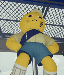 a yellow stuffed animal with a smiley face and a smiley face on his face