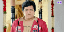 a man wearing a red jacket that says dept 97