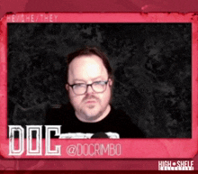 a man wearing glasses and a black shirt with the word dog on it
