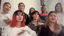 a group of young women are posing for a picture and the caption says tiktok