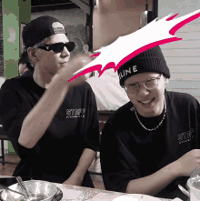 a person wearing a black shirt that says staff