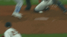 a baseball game is being played in front of a banner that says massmutual