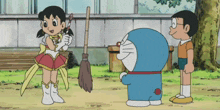 a cartoon of doraemon standing next to a girl and a boy
