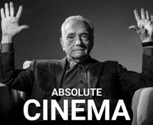 a man sitting in a chair with his hands in the air and the words absolute cinema above him