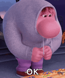 a cartoon character with a big nose is wearing a grey hoodie and purple pants