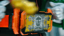 a close up of a toy with a yellow and black design