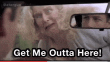 a woman in a car with the words get me outta here written on the screen
