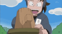 a cartoon character is holding a wooden block with a piece of paper on it .