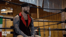 a man in a wrestling ring with backyard pro written on the ropes