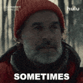 an advertisement for nine perfect strangers shows a man with a beard wearing a red beanie