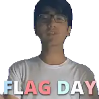a man wearing glasses and a white shirt that says flag day on it