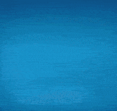 a person is dancing on a stage with a blue light behind them
