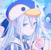 a girl with long white hair wearing a penguin hat .