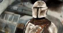 a close up of a person wearing armor with a helmet on