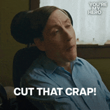 a man in a wheelchair says " cut that crap " in front of a window