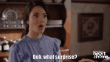 a woman says " ooh what surprise " in front of a super channel logo