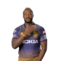 a man in a nokia shirt is clapping