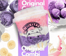 a cup of milkitas original combi with a cow on it