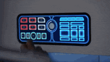 a person is pressing a button on a device that says ' droid ' on it