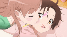 a girl is kissing another girl on the cheek in a cartoon