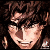 a close up of a man 's face with a smile on his face and a shadow on his face .