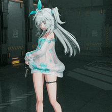 a girl is holding a gun in front of a wall that says 05