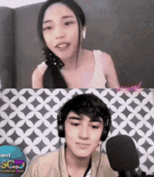 a man and a woman wearing headphones are talking into a microphone