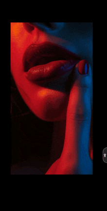 a close up of a woman 's lips with red lipstick