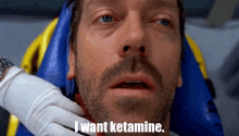a man with a beard is laying in an ambulance and says i want ketamine