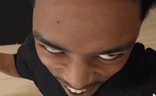 a close up of a man 's face with a nike logo