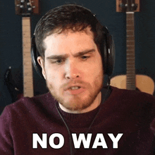 a man wearing headphones says no way