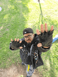 a man wearing gloves and a hat with the letter n on it