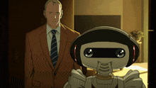 a man in a suit stands next to a robot