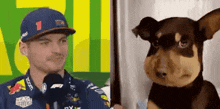 a race car driver is talking to a stuffed dog .