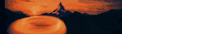 a blurred image of a donut with a mountain in the background .