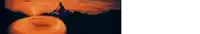 a blurred image of a donut with a mountain in the background .