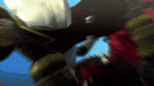 a blurry picture of a man in a red and gold costume