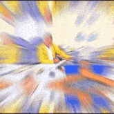 a blurry picture of a man in a yellow jacket holding a microphone