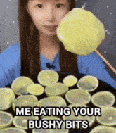 a girl is eating a lemon slice on a stick with the caption " me eating your bushy bits "