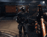 a screenshot of a video game shows a soldier holding a gun